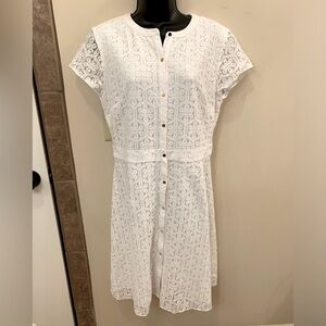 Limited white lacy dress.  Short sleeved.  Size 6.  NWT.